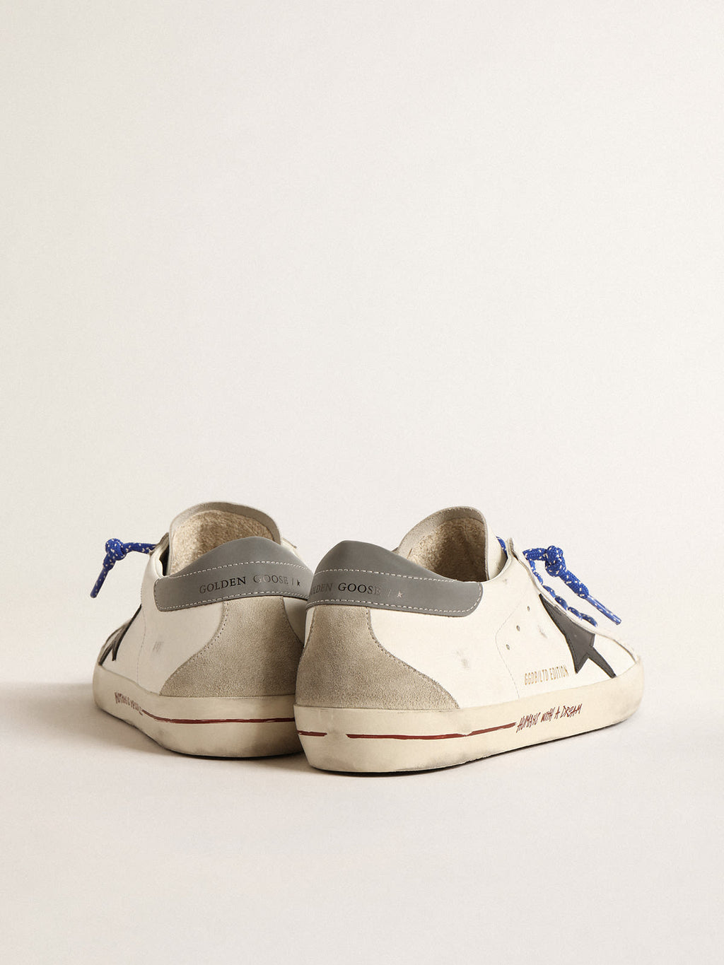 Super-Star LTD con stella in pelle nera e talloncino grigio