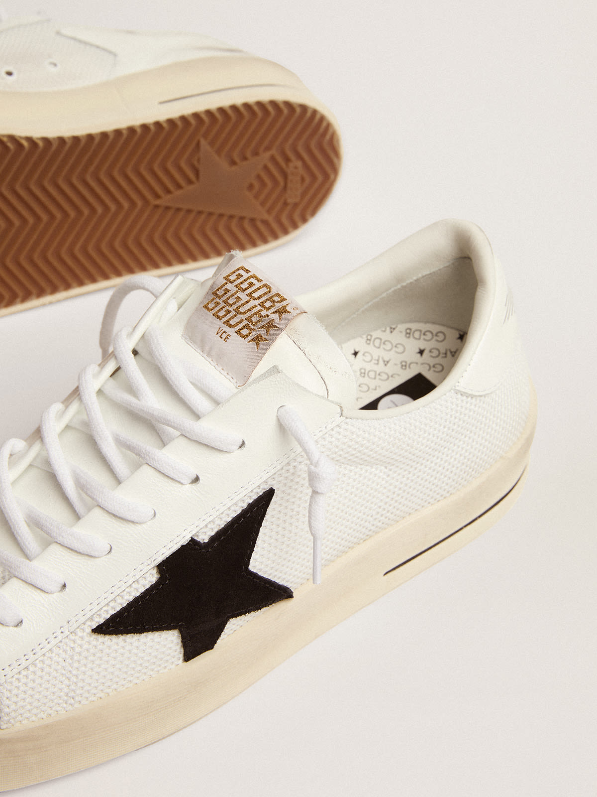 Sneaker Stardan in rete bianca con stella in suede nero e talloncino in pelle bianca