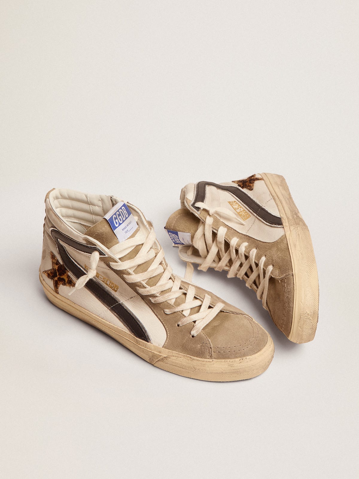 Sneaker Slide con stella in cavallino leopardato e virgola in pelle nera