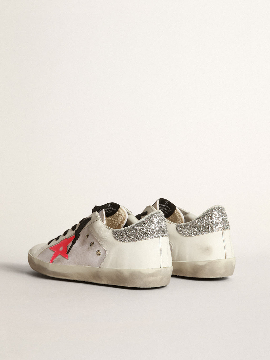 Sneaker Super-Star in pelle e canvas bianchi con stella in pelle rosa shocking e talloncino in glitter argento
