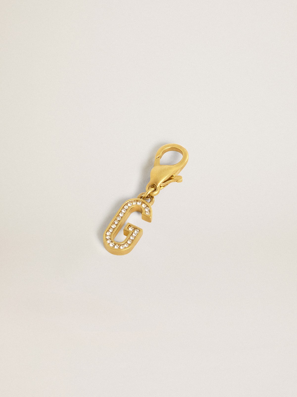 Letter G charm in gold-colored brass with crystals
