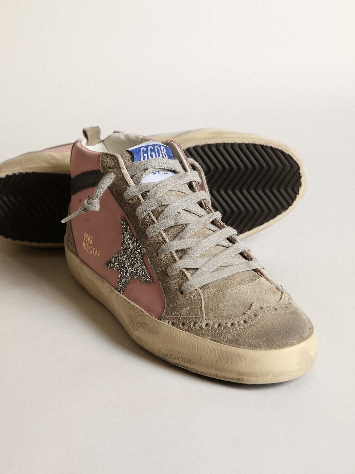 Sneaker Mid Star LTD in pelle rosa con stella in glitter argento e virgola in pelle nera