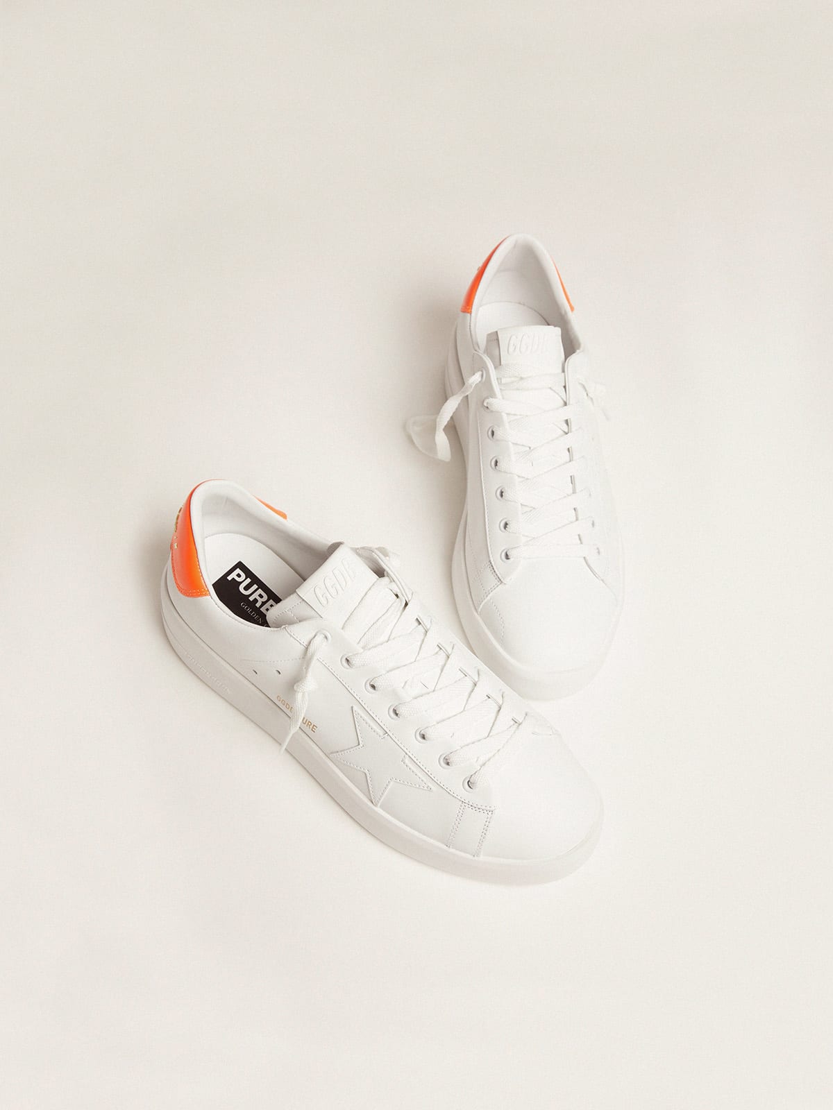 Sneaker Purestar bianche con talloncino arancio fluo