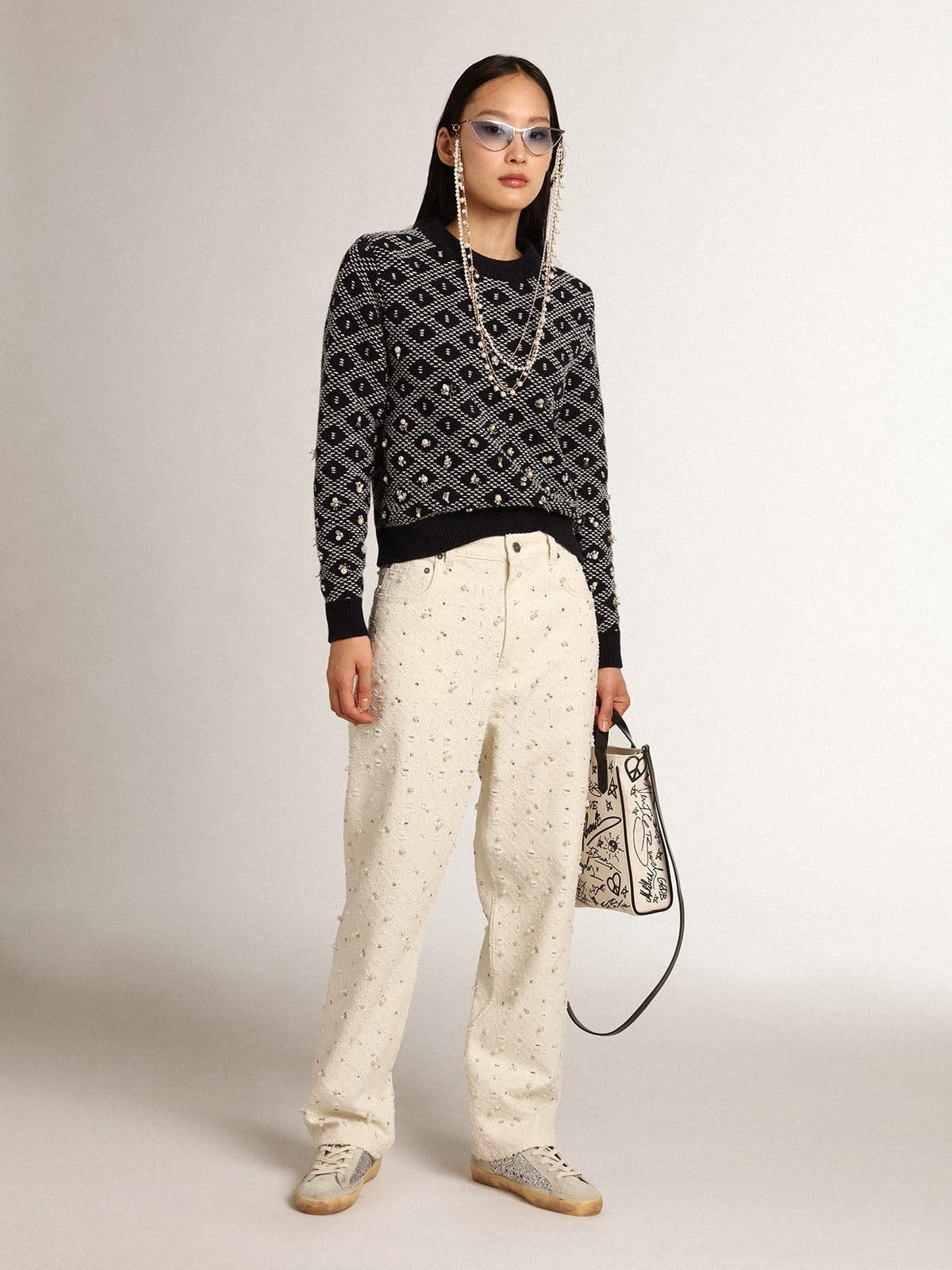 Jeans Kim Collezione Journey in cotone color bianco sporco con motivi a rombi e applicazione di perle e cristalli