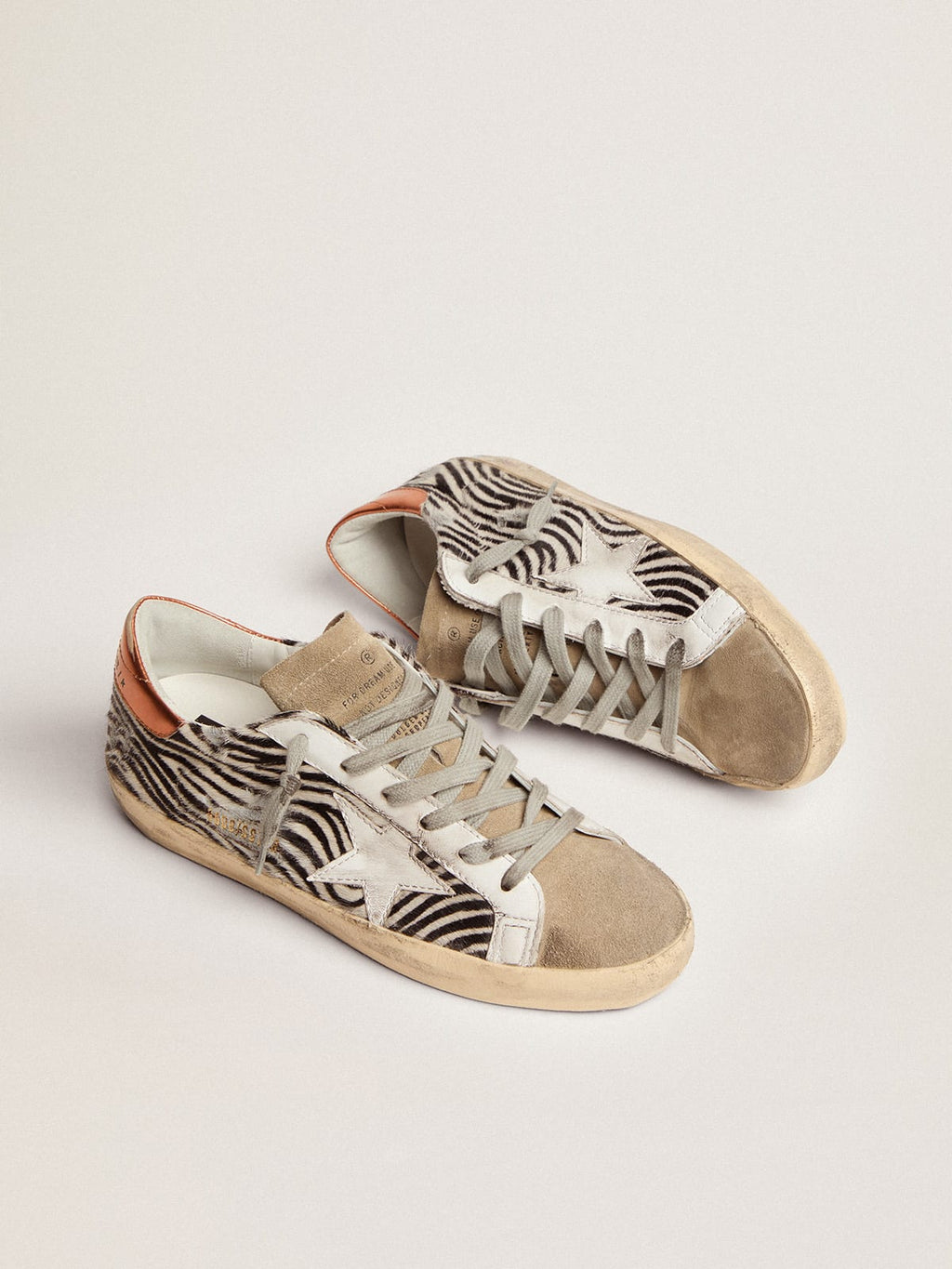 Sneaker Super-Star LTD in cavallino zebrato con stella in pelle bianca e talloncino in pelle laminata color arancione