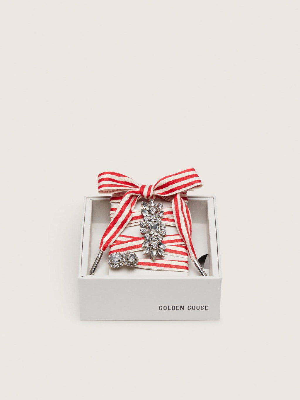 Skins "Playful" red and beige striped laces embellished with two charms