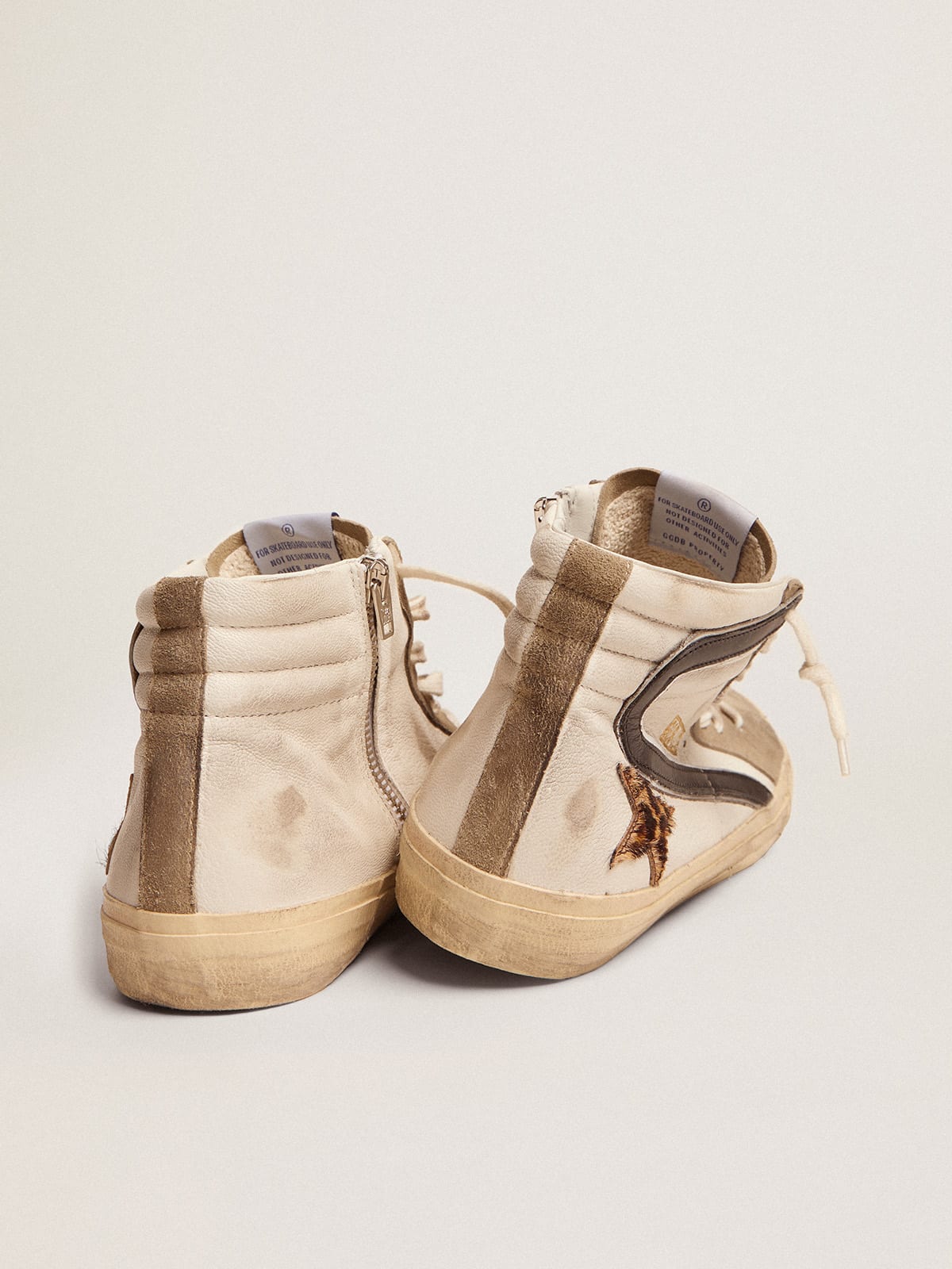 Sneaker Slide con stella in cavallino leopardato e virgola in pelle nera