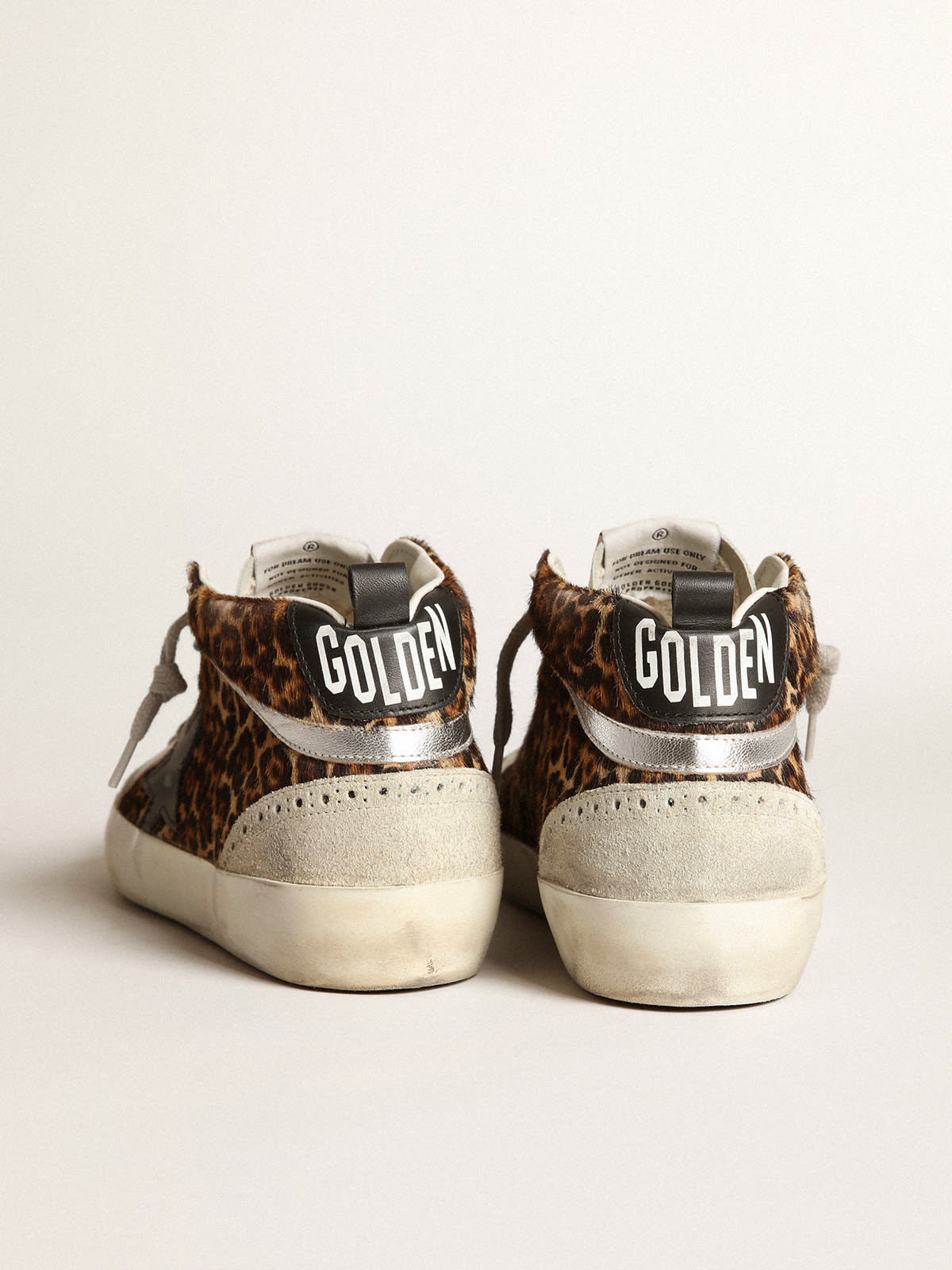 Sneaker Mid Star in cavallino leopardato con stella in pelle nera e virgola in pelle laminata color argento