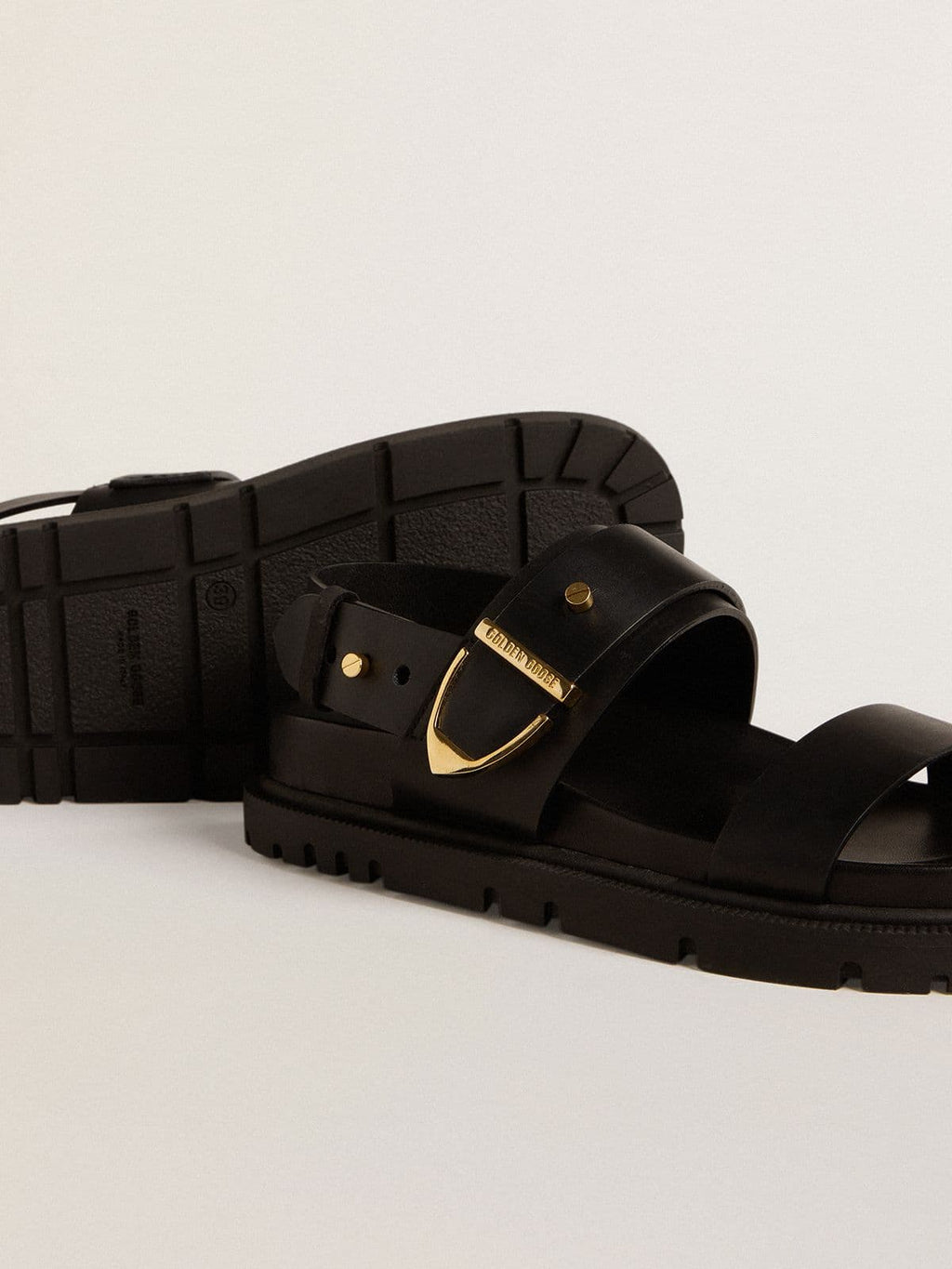 Women's Lucy sandal in glossy black leather with gold metal buckle