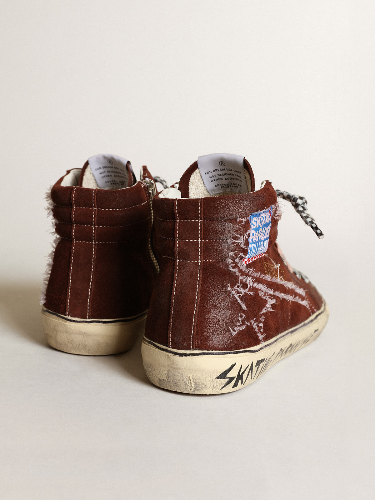Sneaker Slide in suede color cioccolato con stella e virgola con impunture bianche