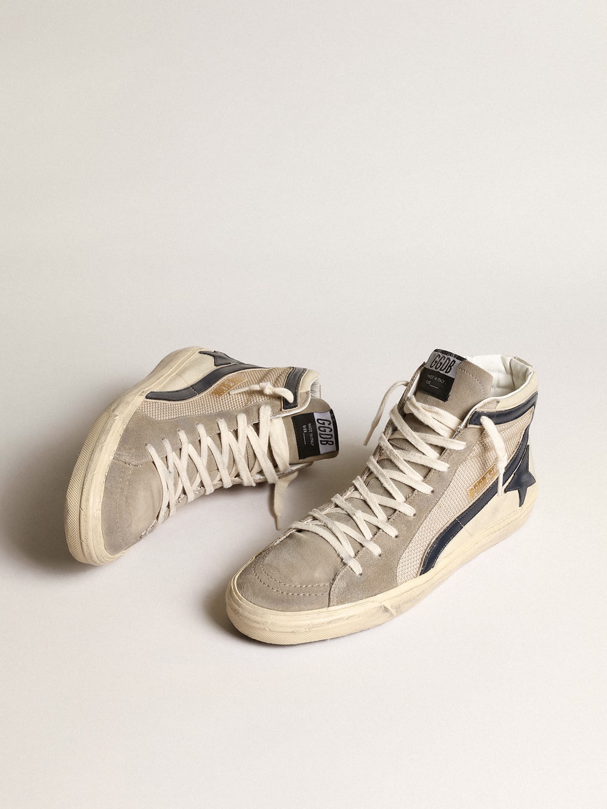 Slide in rete e nylon beige con stella e virgola in pelle blu