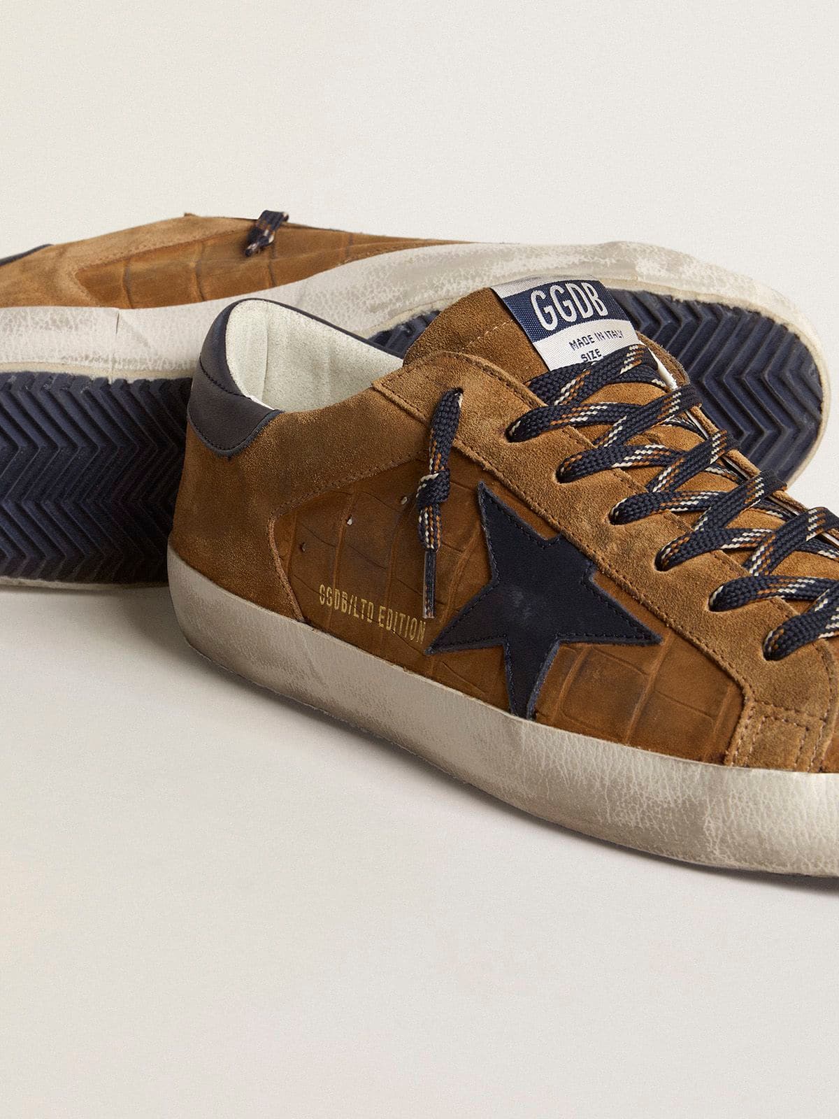 Men's Super-Star LTD in tobacco-colored croc-print leather with midnight blue leather star and heel tab