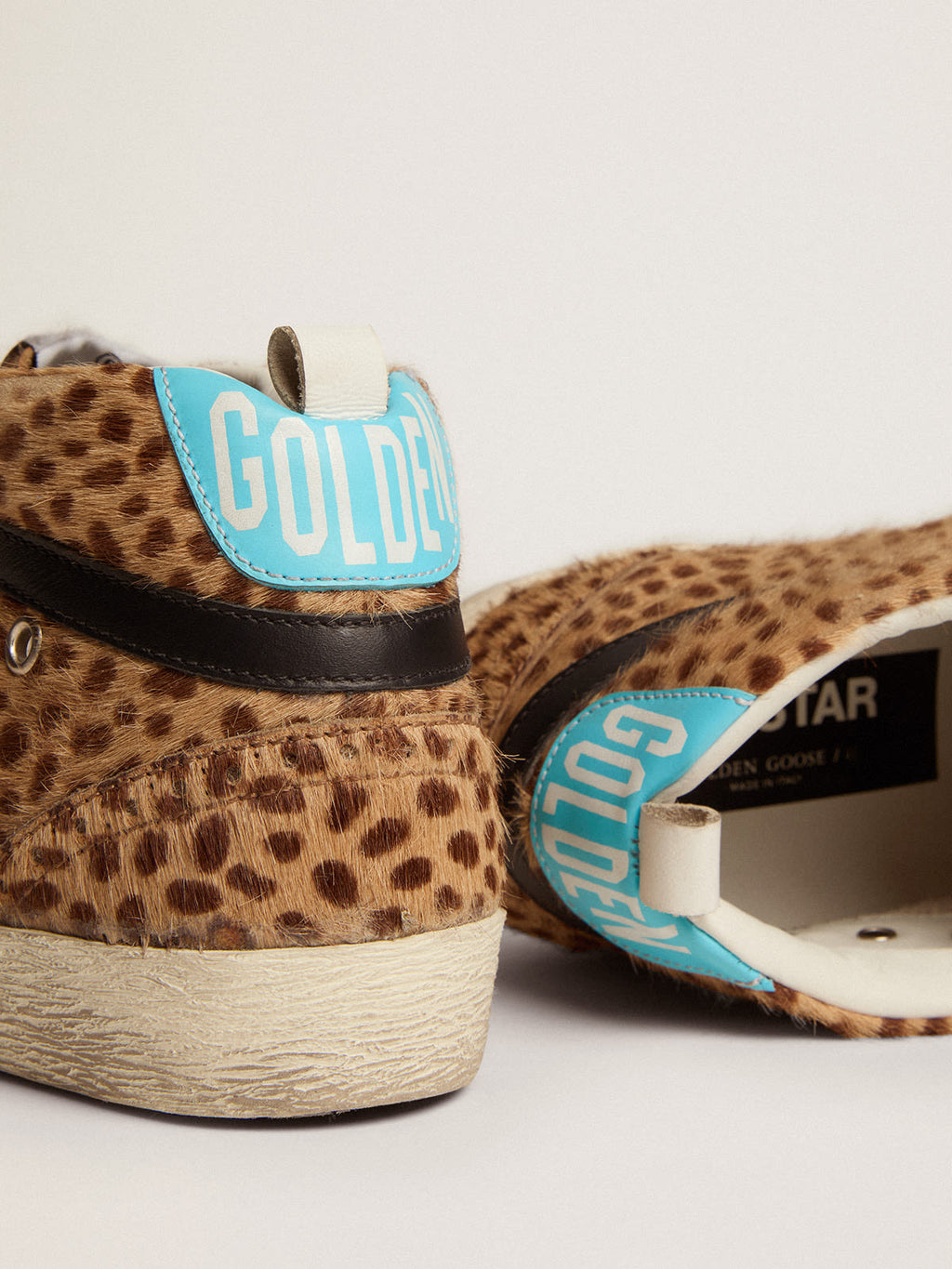 Sneaker Mid Star in cavallino con stampa animalier e stella in glitter argento