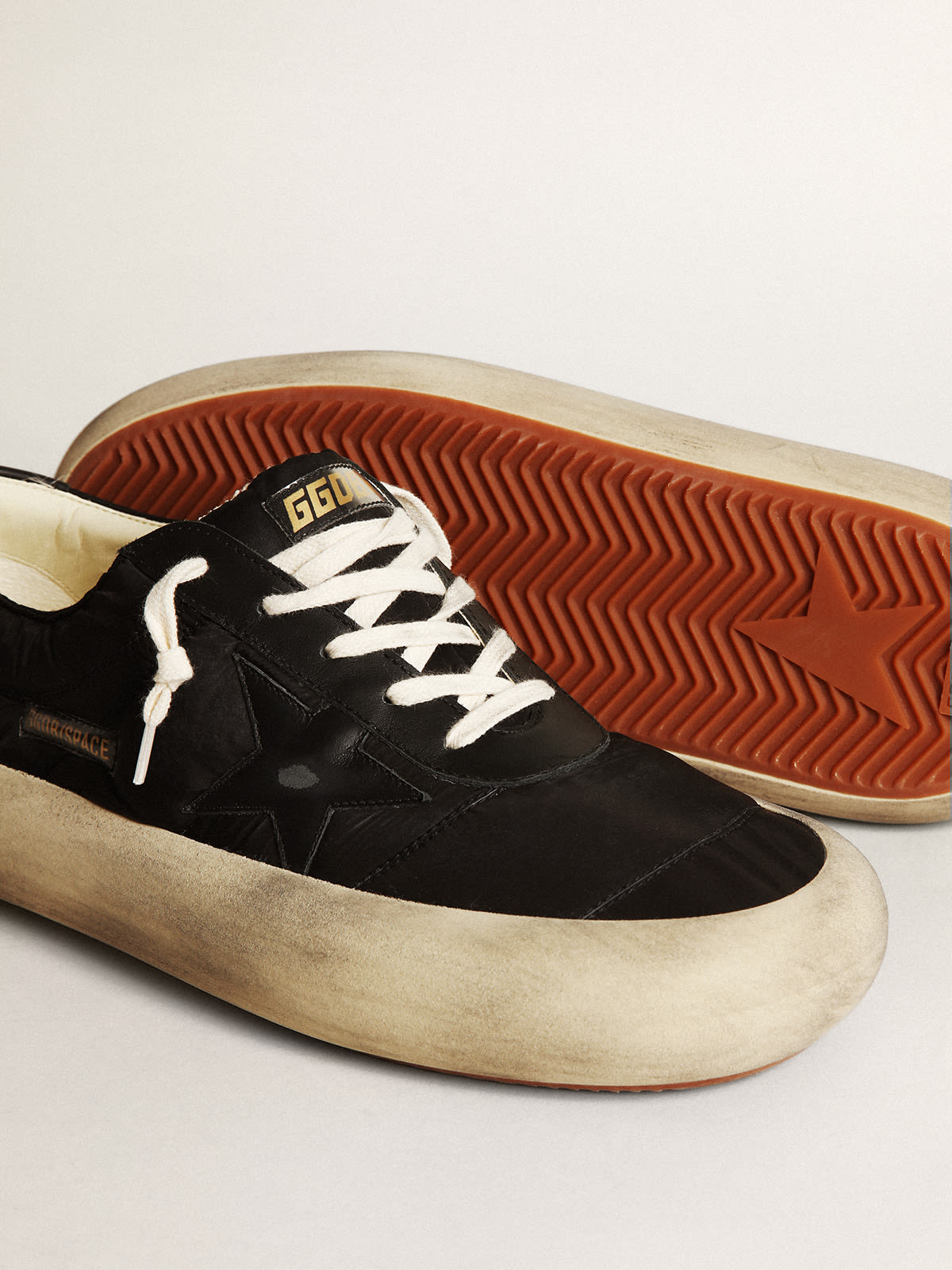 Space-Star Uomo in nylon con stella e talloncino in pelle nera