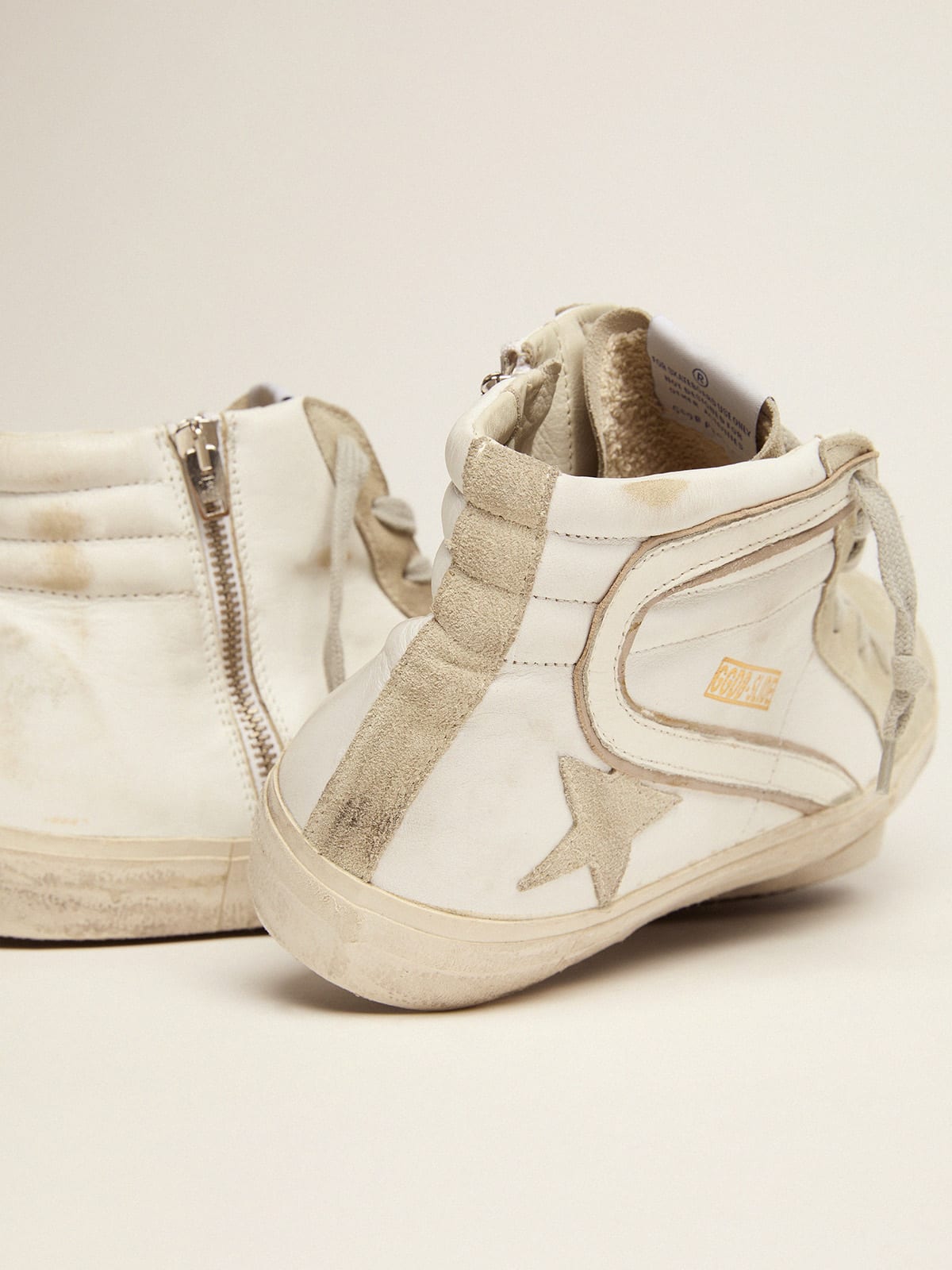 Sneakers Slide in pelle con stella e dettagli in camoscio
