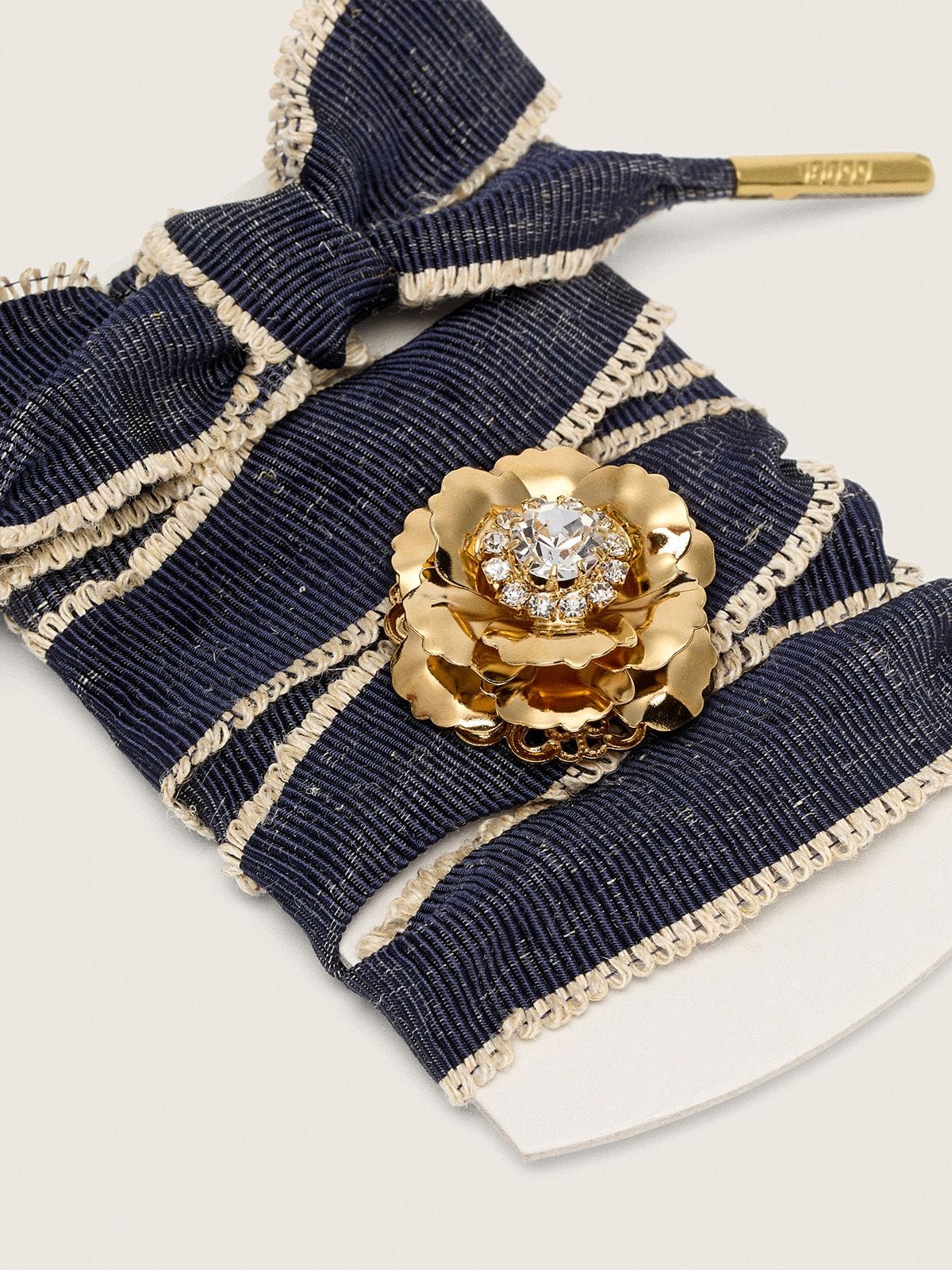 Skins "Sparkling" denim blue laces embellished with beige trim and a golden charm