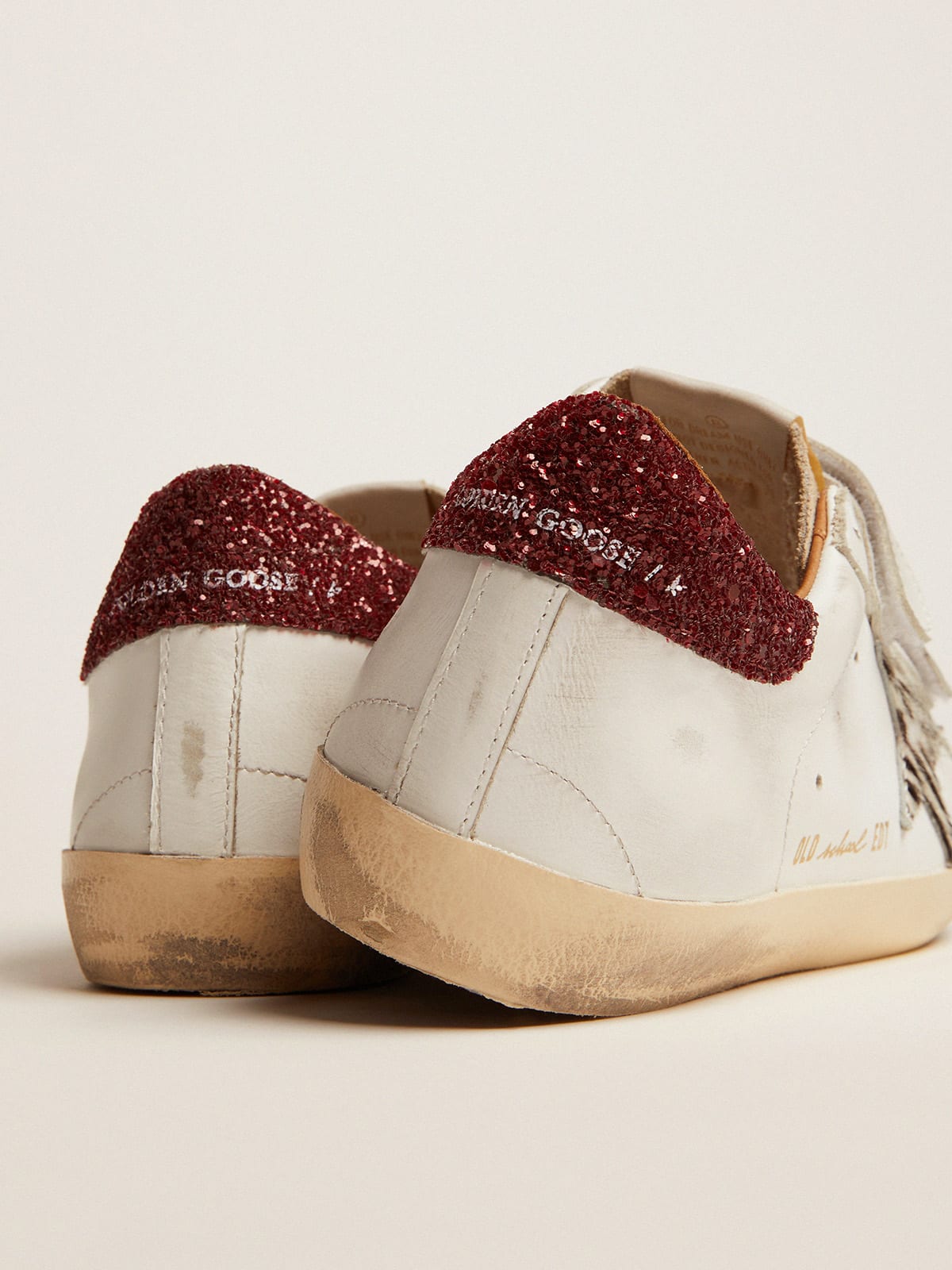 Sneaker Old School con stella in cavallino zebrato e talloncino in glitter rossi