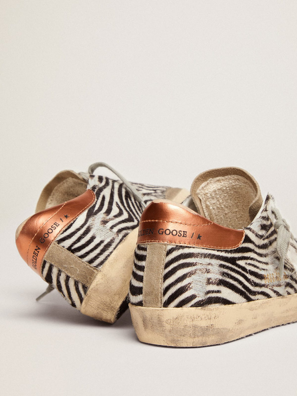 Sneaker Super-Star LTD in cavallino zebrato con stella in pelle bianca e talloncino in pelle laminata color arancione