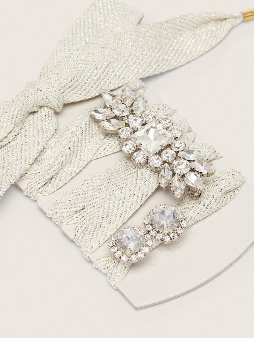 Skins "Sparkling" cream and silver herringbone laces embellished with two charms