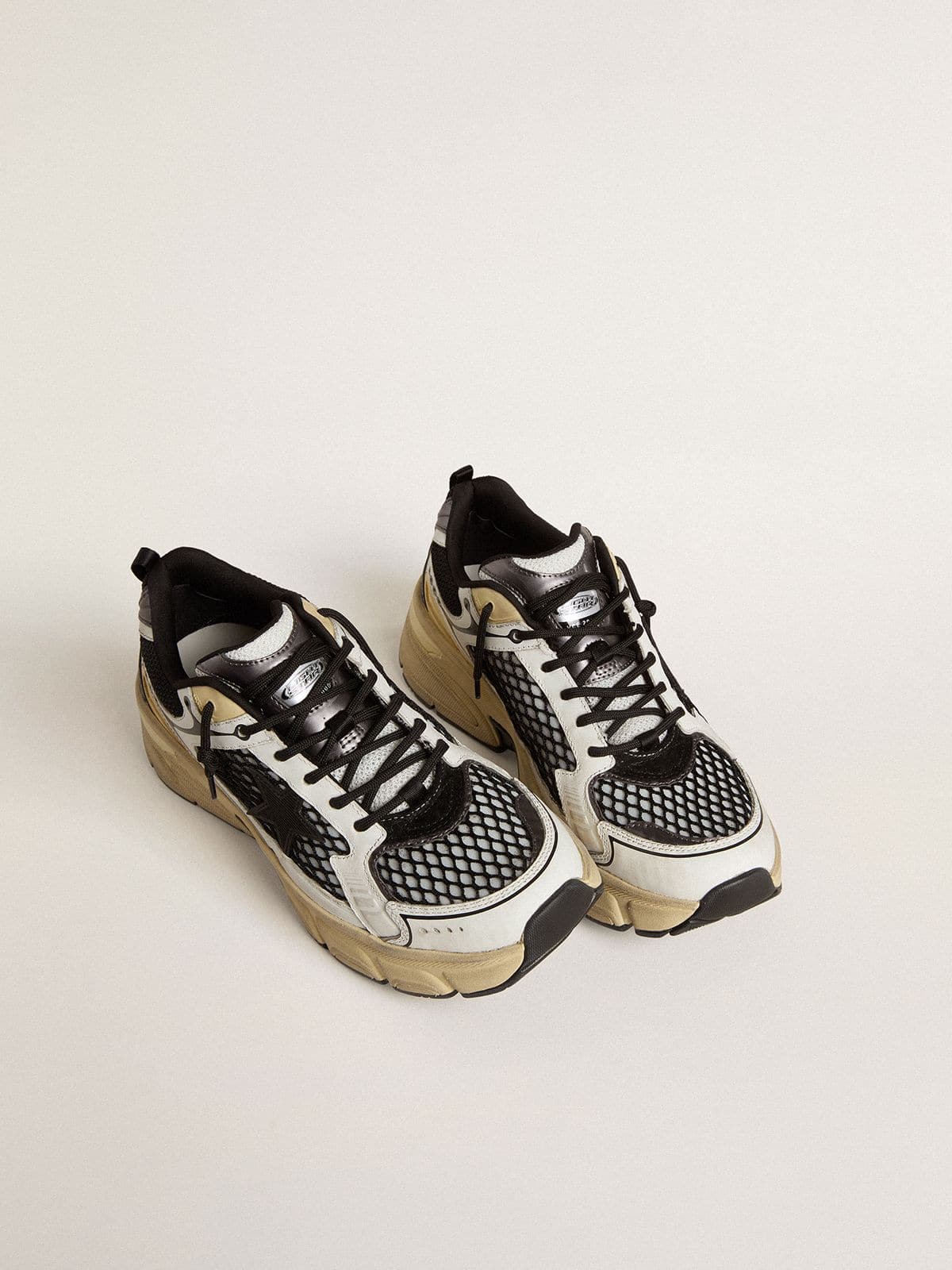Women’s Lightstar in white leather and black mesh with black TPU star