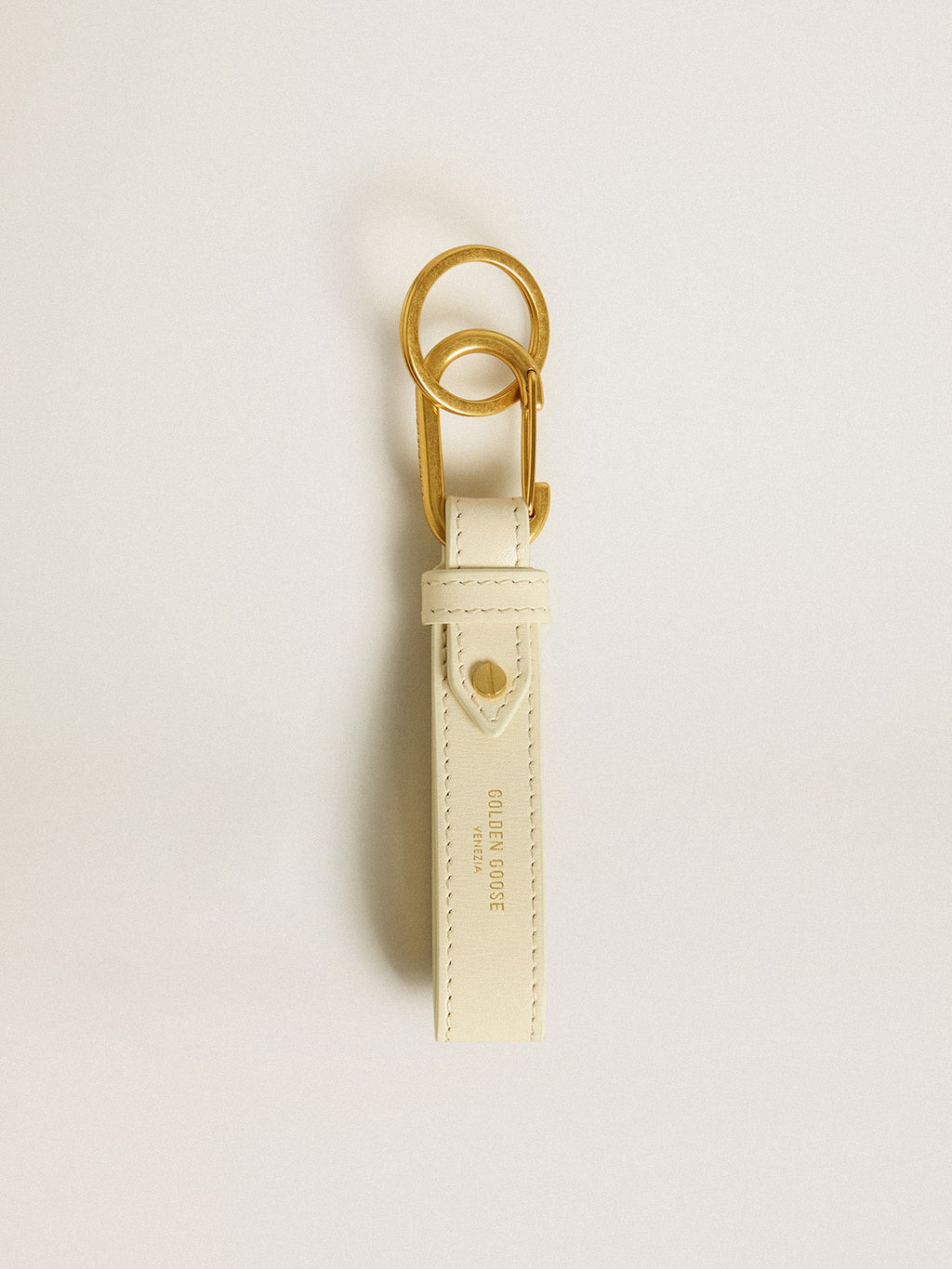 Worn white keyring