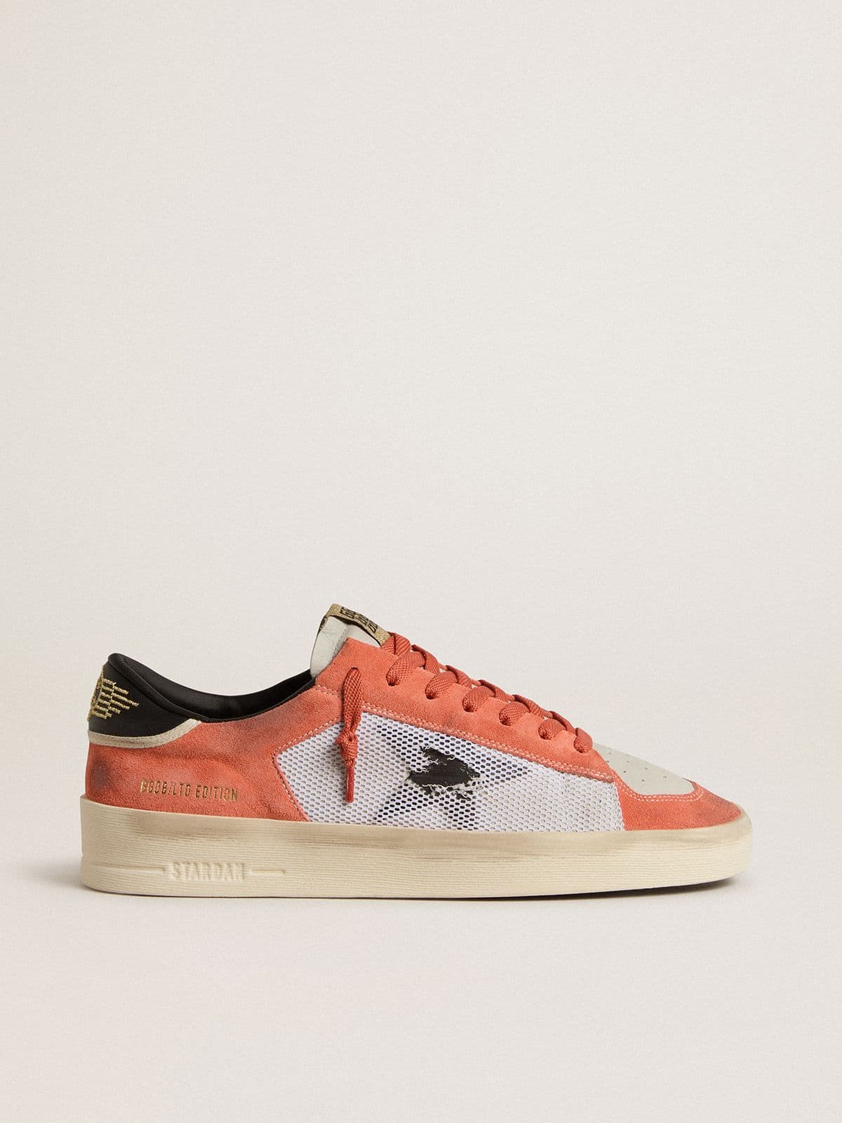 Stardan LTD in coral-colored suede and mesh with black leather star