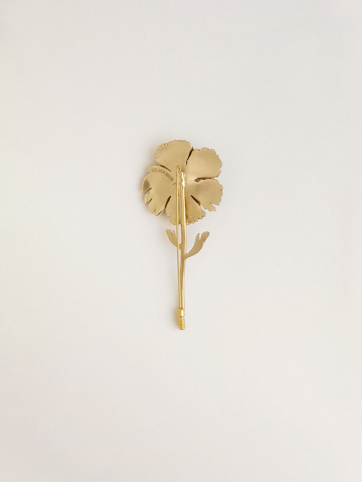 Gold pin with floral design