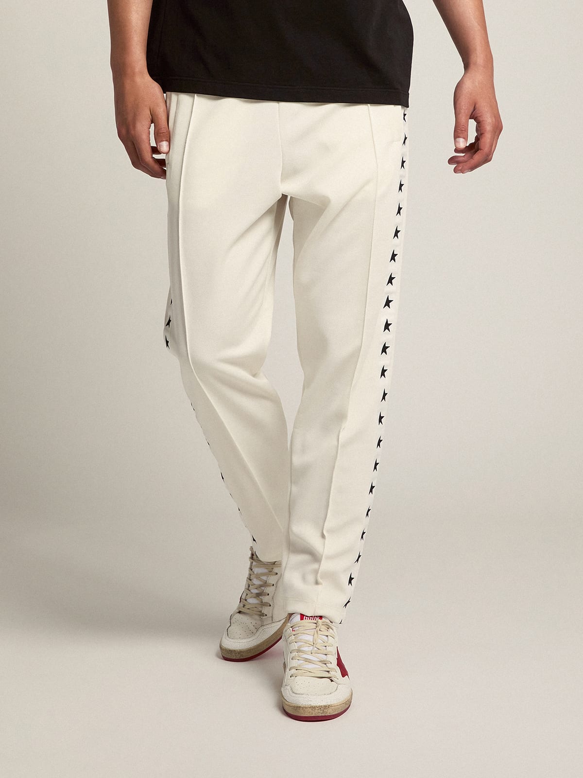 Pantalone jogging da uomo di colore bianco con stelle nere sui lati