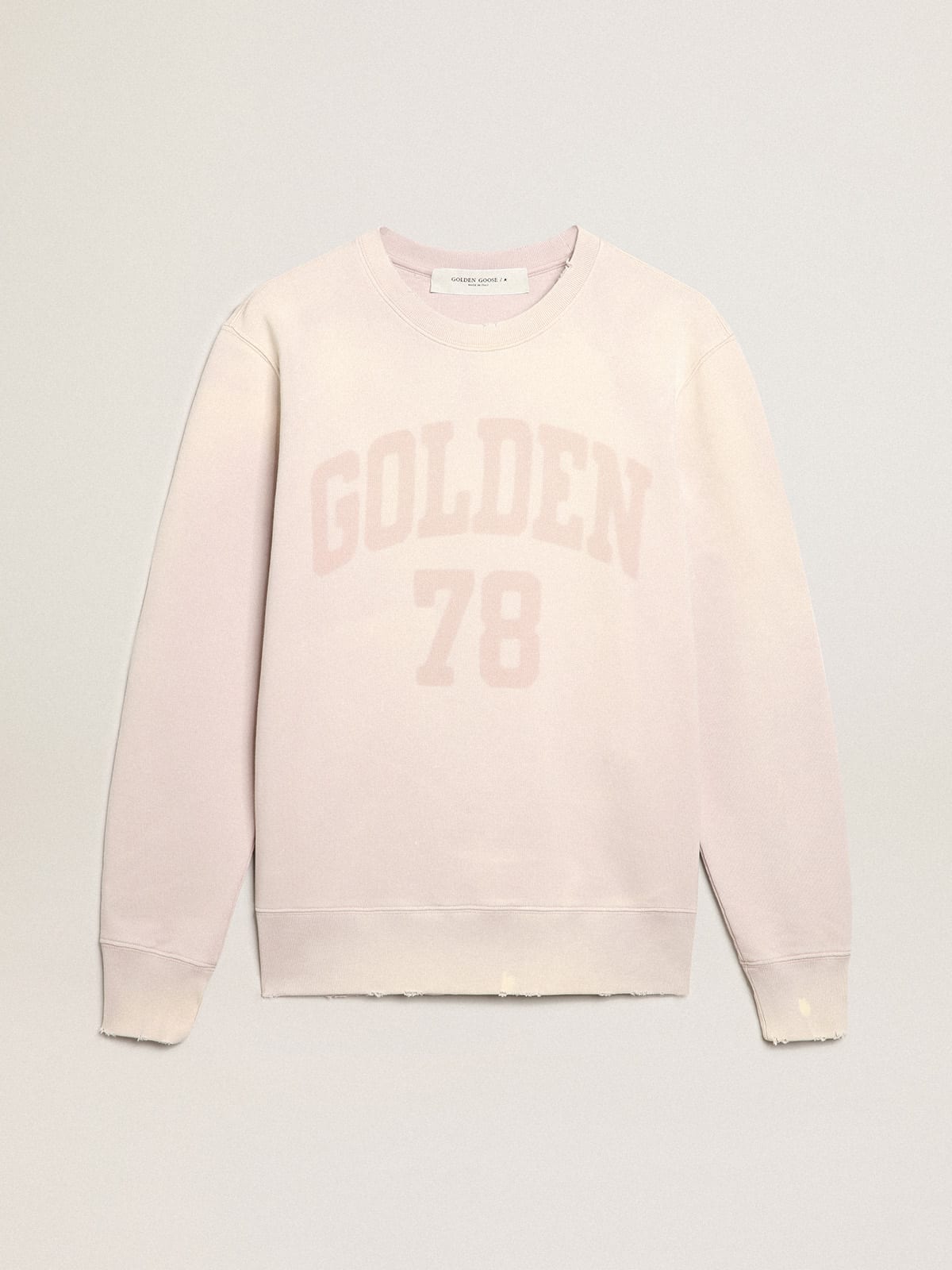 Felpa color rosa pallido dal trattamento distressed