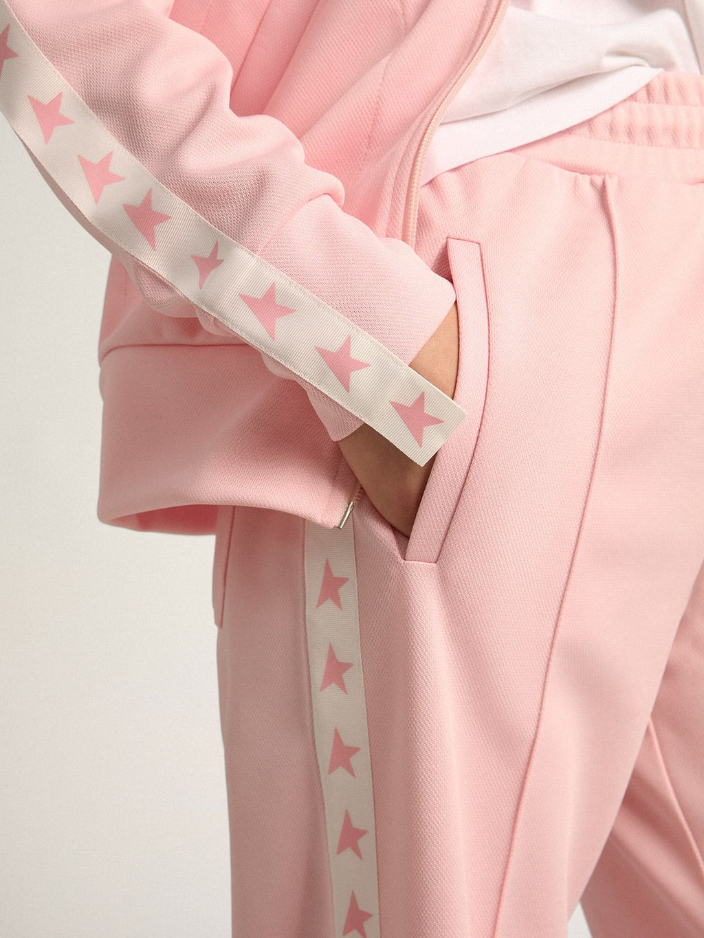 Pantalone jogging da donna di colore rosa con stelle rosa sui lati