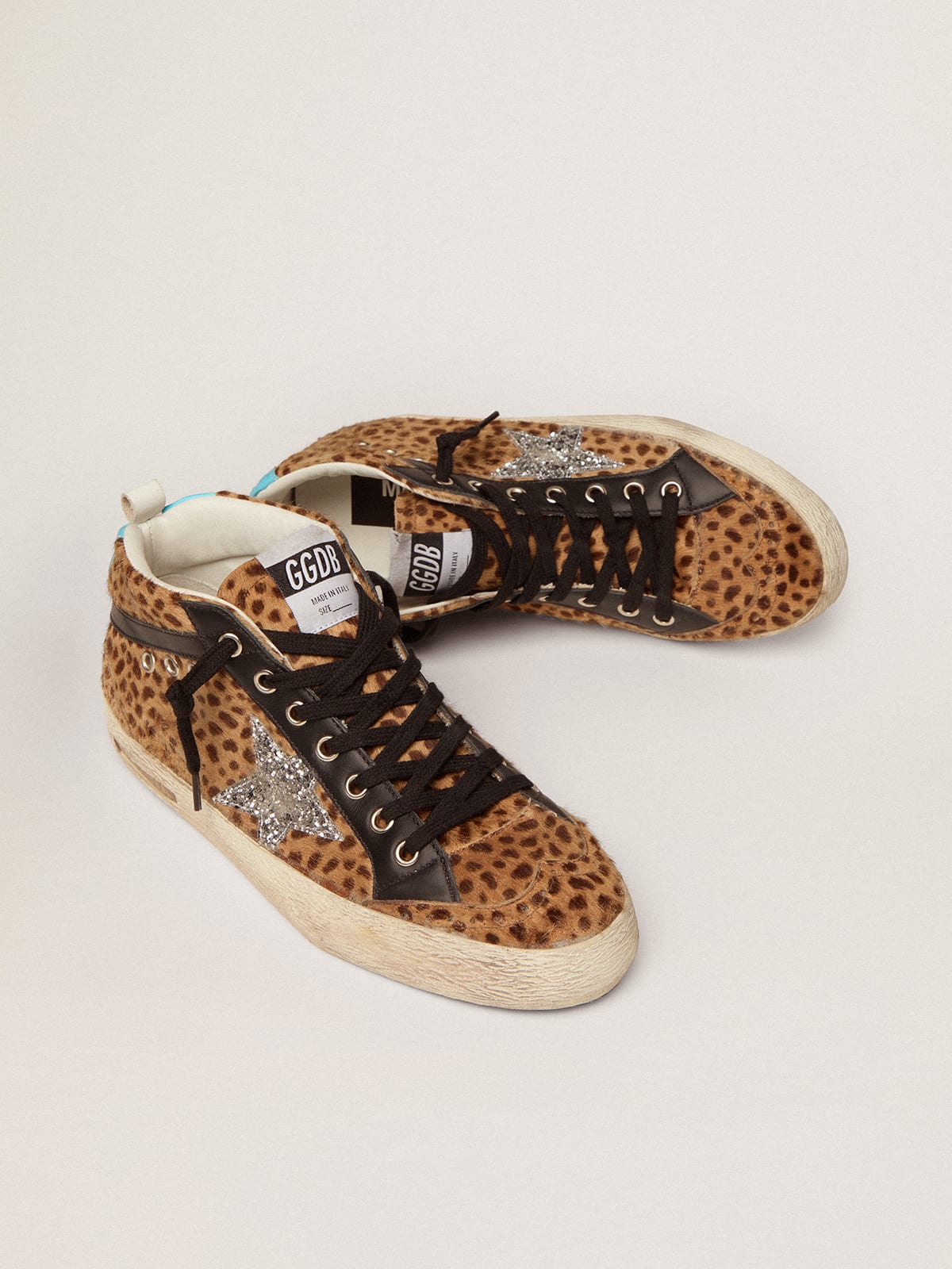 Sneaker Mid Star in cavallino con stampa animalier e stella in glitter argento