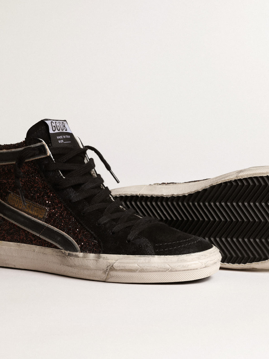 Slide in glitter marroni con stella e virgola in pelle nera