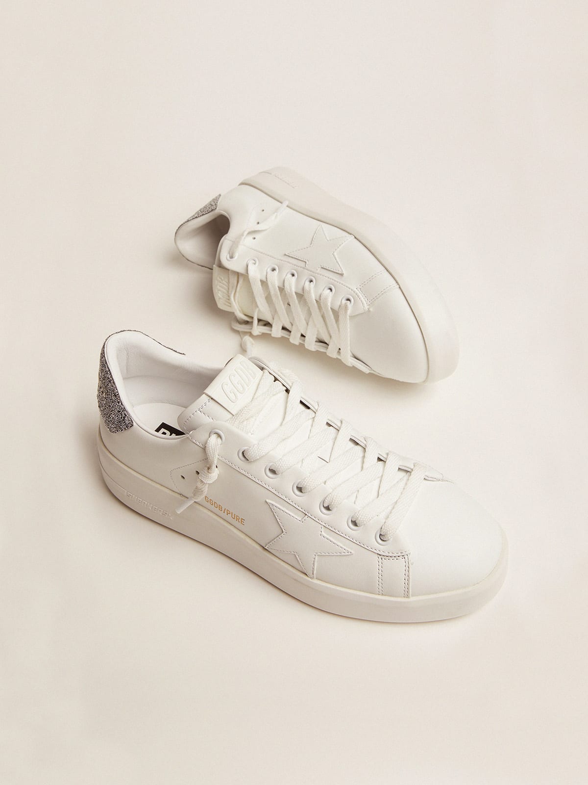 Sneaker Purestar in pelle bianca con talloncino in cristalli Swarovski argento