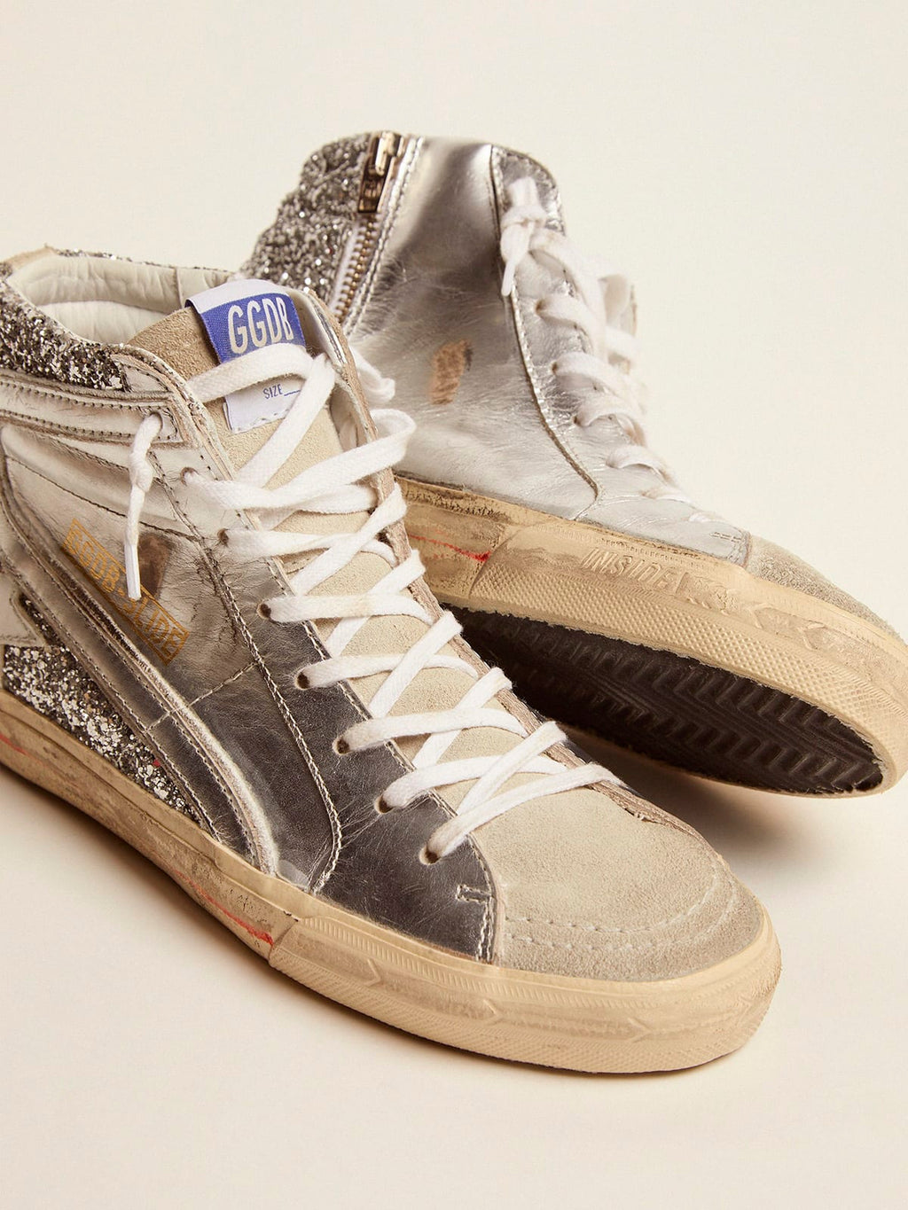 Sneaker Slide con tomaia in pelle laminata e glitter argento