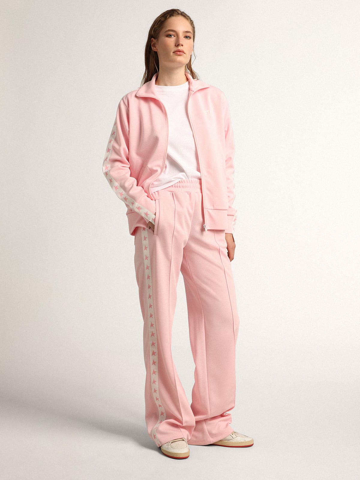 Pantalone jogging da donna di colore rosa con stelle rosa sui lati